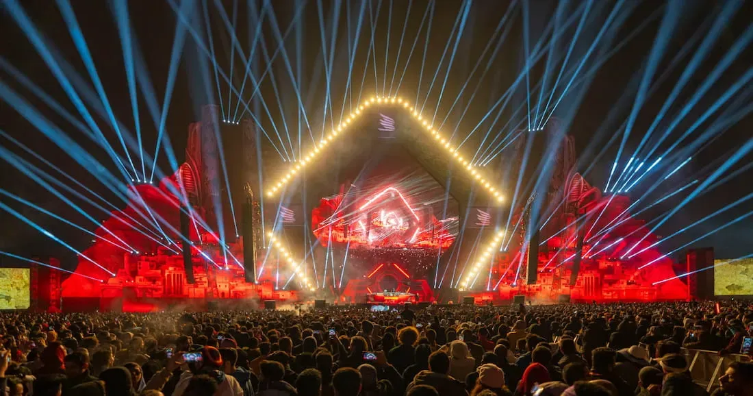 Concert crowd and illuminated festival stage