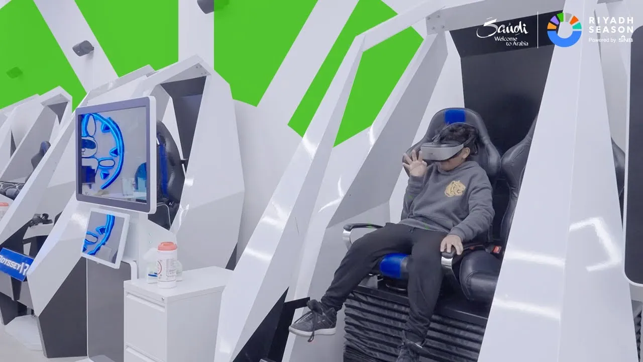 Visitor wearing VR headset in an Odyssey attraction seat