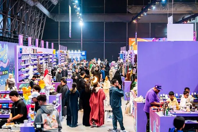 Indoor sneaker exhibition aisles and crowd